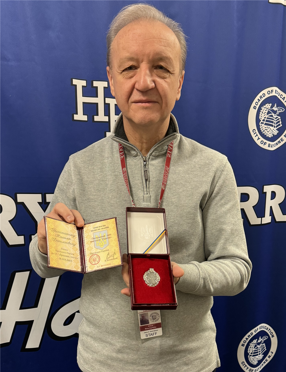  Vasyl Hrechynsky stands with medal and letter from Ukraine President.